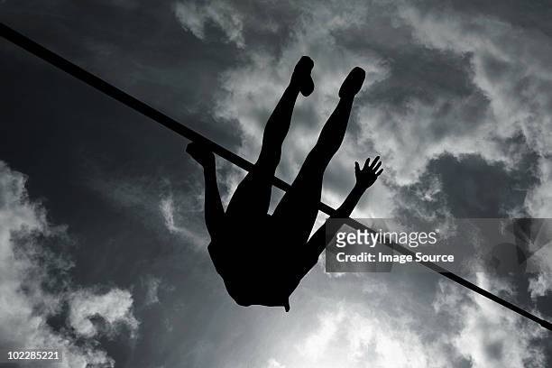 silhouette of high jumper - high jumper stock pictures, royalty-free photos & images