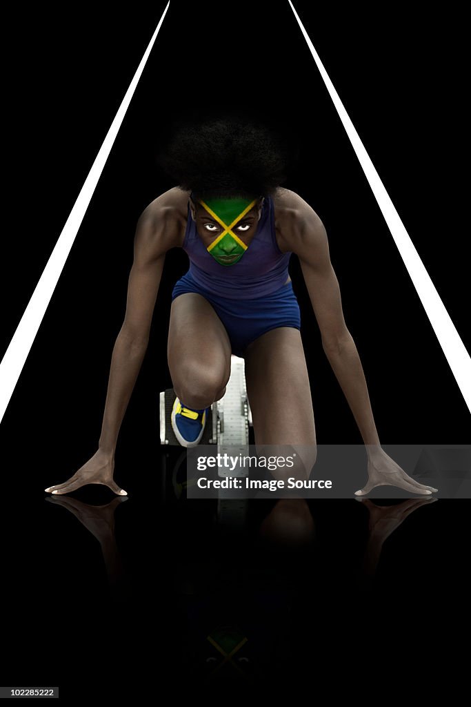 Sportler mit Jamaikanische Flagge Gesicht Farbe