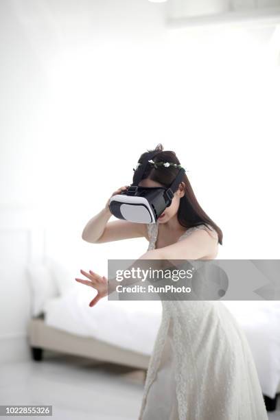 bride wearing vr at home - virtual ceremony stock pictures, royalty-free photos & images