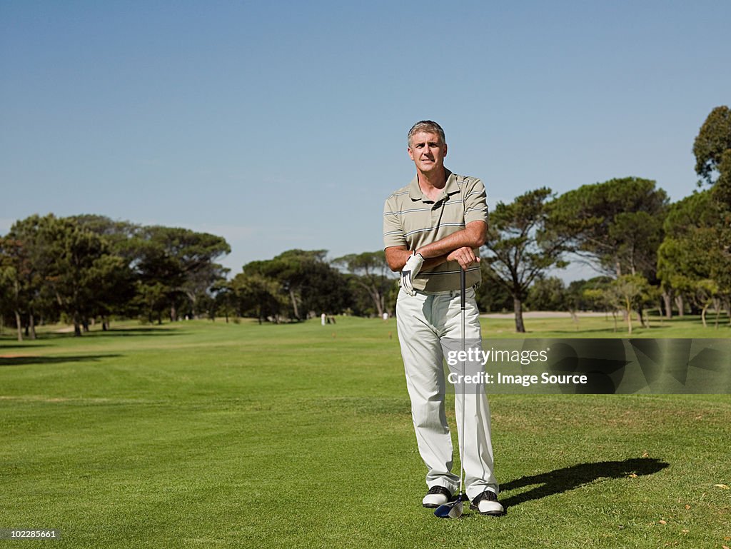 Man playing golf on golf course