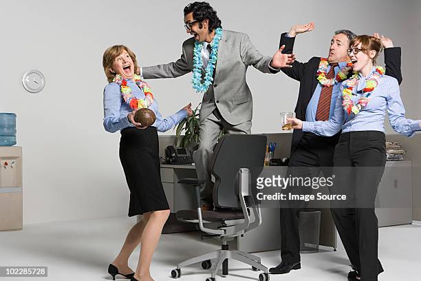 business people enjoying office party - office party stock pictures, royalty-free photos & images