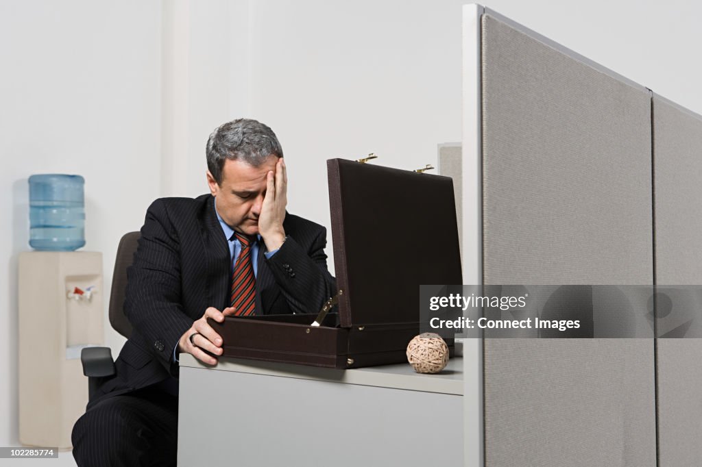 Businessman with head in hands