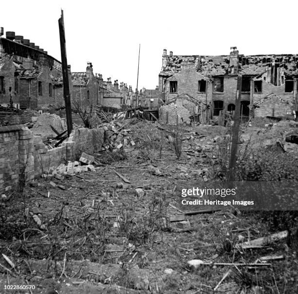 Wartime bomb damage, Long Acre, Nechells, Birmingham, West Midlands, World War II, 29 July 1942. View of the rear of Long Acre and Crompton Road...