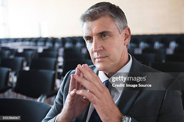 businessman in conference room - voorzitter stockfoto's en -beelden
