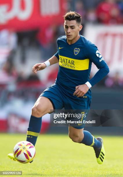 Cristian Pavon of Boca Juniors drives the ball during a match between Estudiantes and Boca Juniors as part of Superliga Argentina 2018/19 at Estadio...