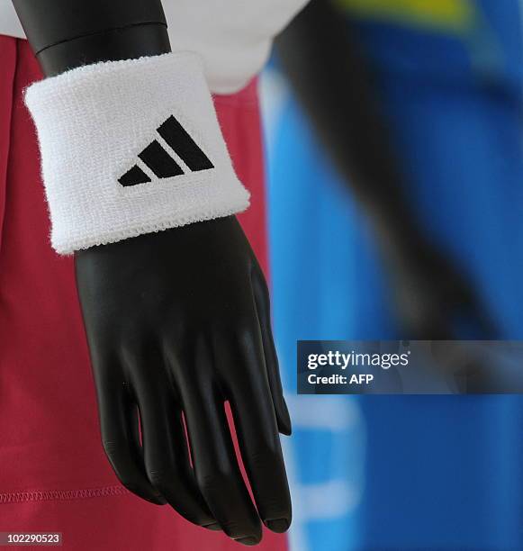 Sweatband of German sportswear and equipment group Adidas is on display at the company's headquarters in Herzogenaurach, southern Germany, June 21,...