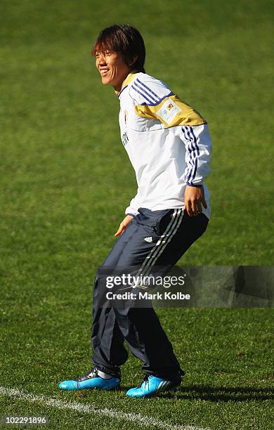 Shunsuke Nakamura smiles as he stretches at a Japan training session during the FIFA 2010 World Cup at Outeniqua Stadium on June 22, 2010 in George,...