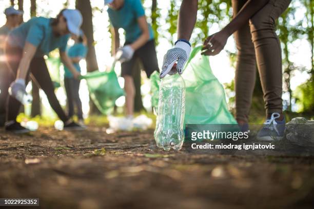 environmental volunteers - volunteers cleaning public park stock pictures, royalty-free photos & images