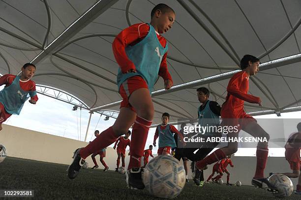 Children train at the Mohammed VI Football Academy on June 11, 2010 in Sale, near the capital Rabat. Morroco, which is not participating in the FIFA...