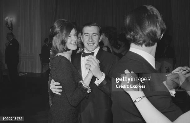 British Formula One racing driver Jackie Stewart with his wife Helen dancing together at the Doghouse Owners’ Ball, London, UK, 24th November 1965.