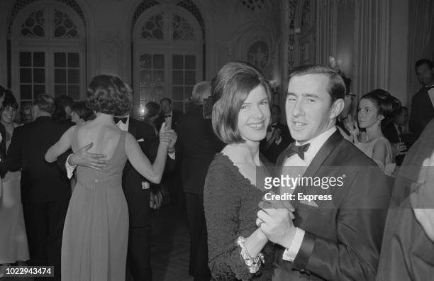 British Formula One racing driver Jackie Stewart with his wife Helen dancing together at the Doghouse Owners’ Ball, London, UK, 24th November 1965.