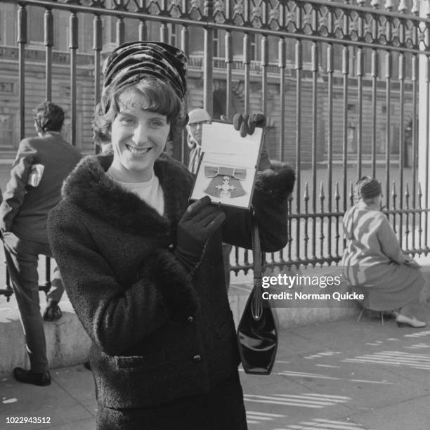 English sprinter Dorothy Hyman with her MBE outside Buckingham Palace, London, UK, 6th November 1965.