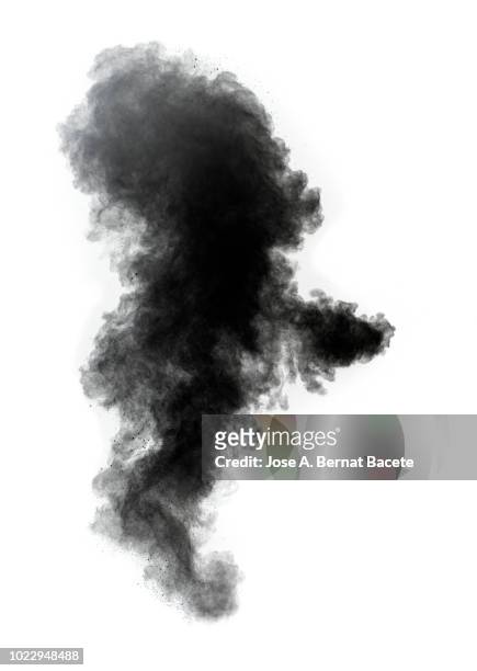 full frame of forms and textures of an explosion of powder and smoke of color gray and black on a white background. - vapore foto e immagini stock