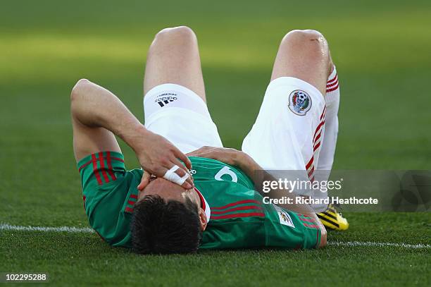 Guillermo Franco of Mexico lies on the pitch during the 2010 FIFA World Cup South Africa Group A match between Mexico and Uruguay at the Royal...