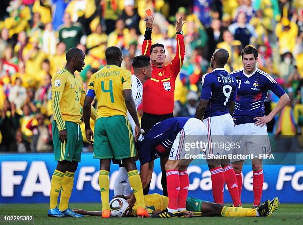 Referee Oscar Ruiz of Colombia sends off Yoann Gourcuff of France during the 2010 FIFA World Cup South Africa Group A match between France and South...