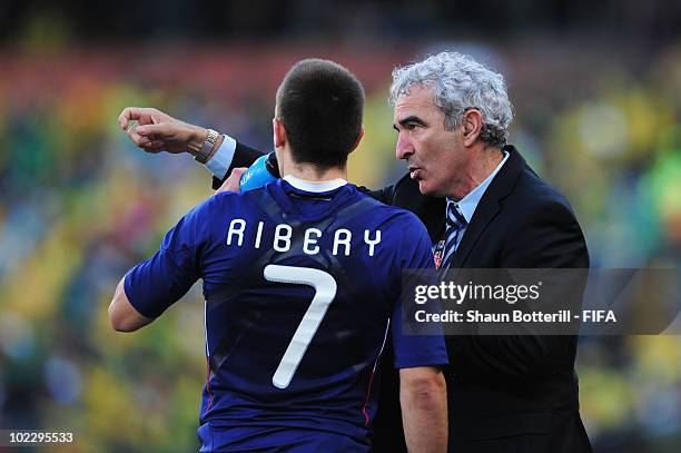 Raymond Domenech head coach of France gives instructions to Franck Ribery during the 2010 FIFA World Cup South Africa Group A match between France...