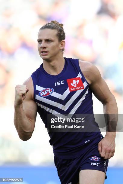 Nathan Fyfe of the Dockers celebrates a goal during the round 23 AFL match between the Fremantle Dockers and the Collingwood Magpies at Optus Stadium...