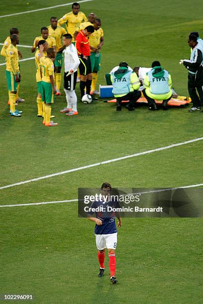 Yoann Gourcuff of France leaves the field after being given a red card following a challenge on MacBeth Sibaya of South Africa during the 2010 FIFA...