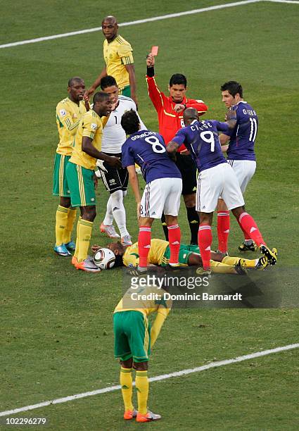 Djibril Cisse of France appeals to Referee Oscar Ruiz as he awards Yoann Gourcuff of France with a red card during the 2010 FIFA World Cup South...
