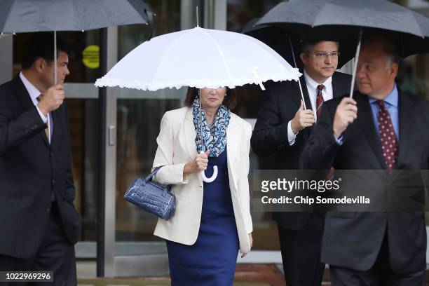 Kathleen Manafort , wife of former Trump campaign chairman Paul Manafort, and his attorneys Richard Westling and Thomas Zehnle walk back to the...