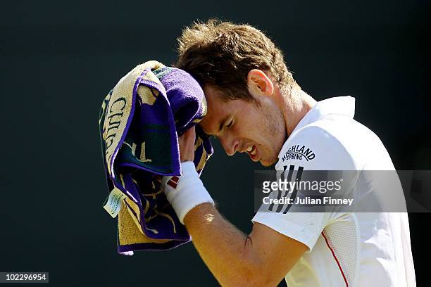 Andy Murray of Great Britain in action during his first round match against Jan Hajek of Czech Republic on Day Day of the Wimbledon Lawn Tennis...
