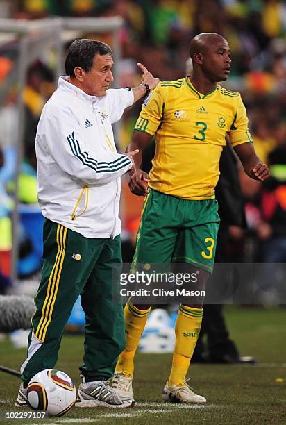 Carlos Alberto Parreira head coach of South Africa instructs team mates as Tsepo Masilela of South Africa looks on during the 2010 FIFA World Cup...