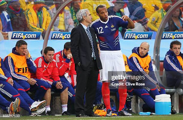 Raymond Domenech head coach of France brings on Thierry Henry as a substitute during the 2010 FIFA World Cup South Africa Group A match between...