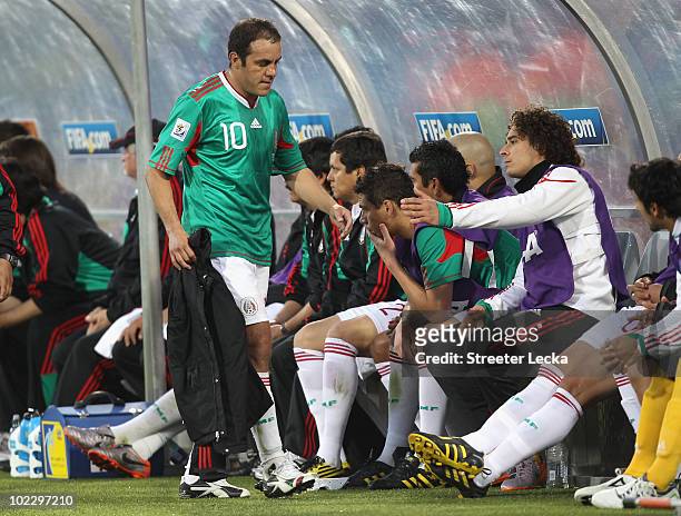 Cuauhtemoc Blanco of Mexico shakes hands with team mates as he is substituted during the 2010 FIFA World Cup South Africa Group A match between...