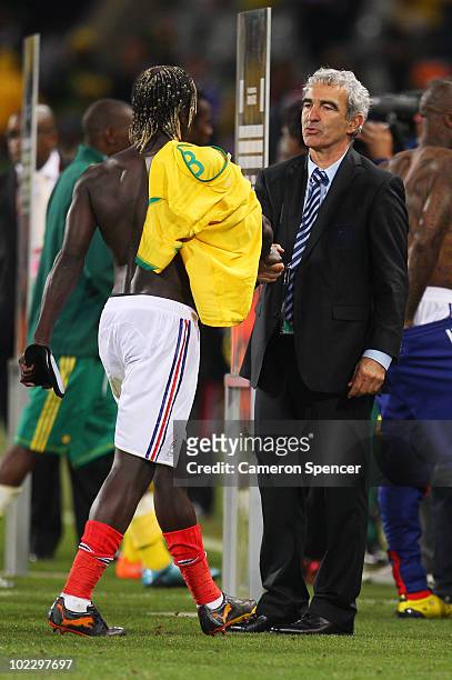Raymond Domenech head coach of France shakes hands with Bakari Sagna after being defeated in the 2010 FIFA World Cup South Africa Group A match...