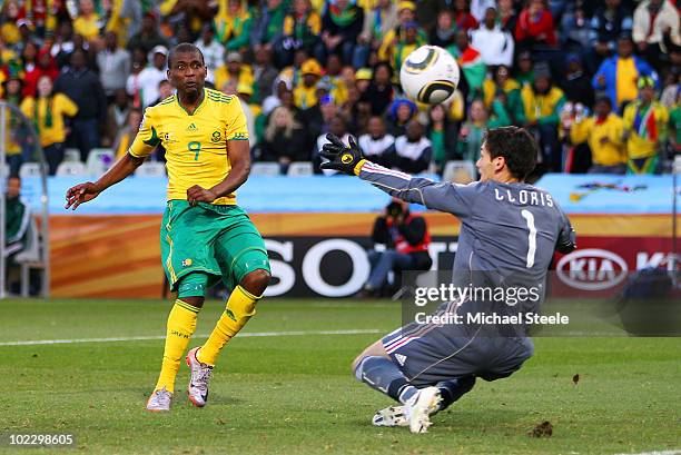 Katlego Mphela of South Africa shoots at goal during the 2010 FIFA World Cup South Africa Group A match between France and South Africa at the Free...