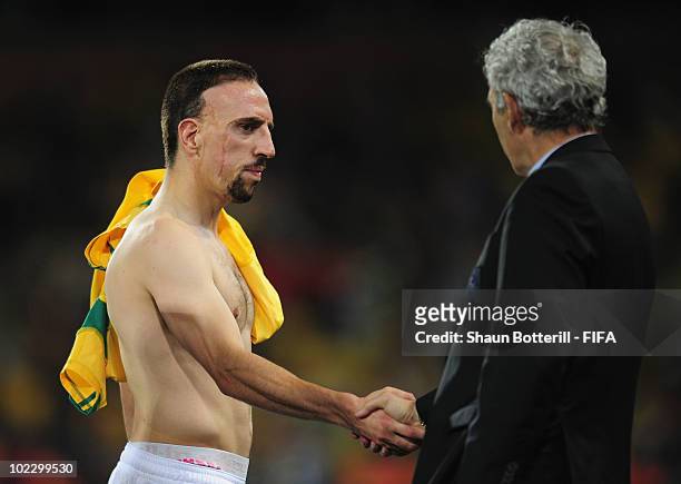 Franck Ribery of France shakes hands with Raymond Domenech head coach of France after the 2010 FIFA World Cup South Africa Group A match between...