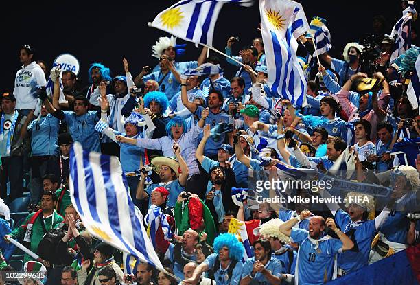 Uruguay fans celebrate after the 2010 FIFA World Cup South Africa Group A match between Mexico and Uruguay at the Royal Bafokeng Stadium on June 22,...