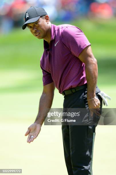 Tiger Woods reacts to his putt on the sixth hole during the second round of the Quicken Loans National at TPC Potomac on June 29, 2018 in Potomac,...