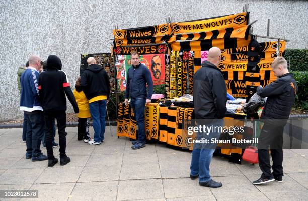 Fans purchase match day merchandise ahead of the Premier League match between Wolverhampton Wanderers and Manchester City at Molineux on August 25,...