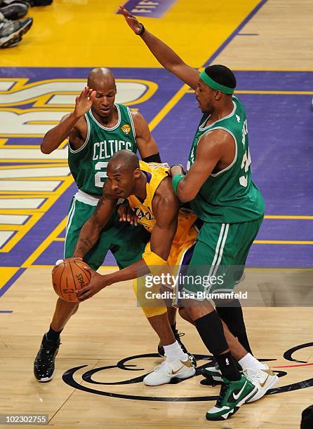 Kobe Bryant of the Los Angeles Lakers looks to move the ball as he is double-teammed by Ray Allen and Paul Pierce of the Boston Celtics in Game Seven...