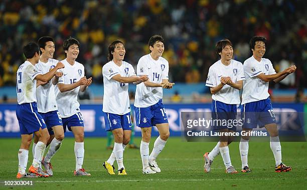 Lee Jung-Soo of South Korea celebrates with team mates after scoring the equalising goal during the 2010 FIFA World Cup South Africa Group B match...