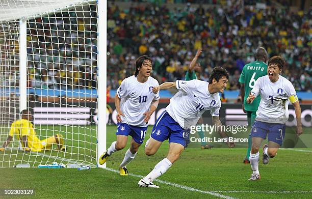 Lee Jung-Soo of South Korea celebrates with team mates after scoring the equalising goal during the 2010 FIFA World Cup South Africa Group B match...