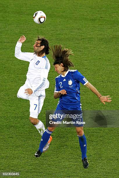 Martin Demichelis of Argentina challenges Georgios Samaras of Greece during the 2010 FIFA World Cup South Africa Group B match between Greece and...