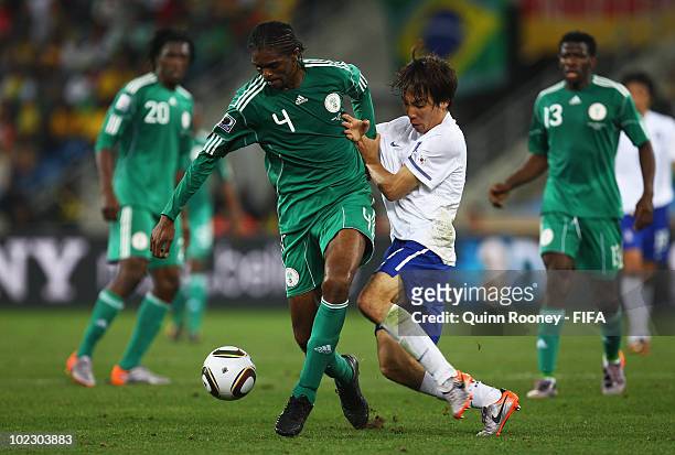 Cho Yong-Hyung of South Korea fouls Nwankwo Kanu of Nigeria during the 2010 FIFA World Cup South Africa Group B match between Nigeria and South Korea...