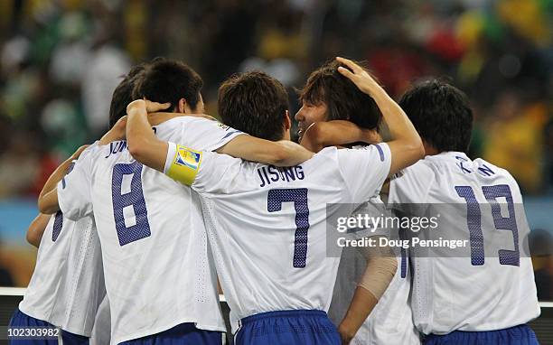 Park Ji-Sung of South Korea celebrates with goalscorer Park Chu-Young of South Korea and team mates after he scores from a free kick during the 2010...