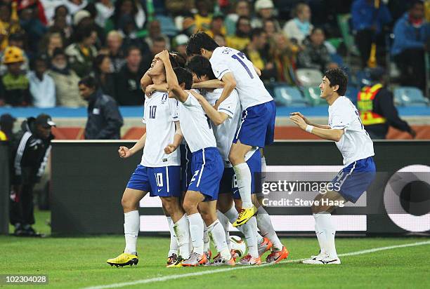 Park Chu-Young of South Korea celebrates with team mates after he scores from a free kick during the 2010 FIFA World Cup South Africa Group B match...