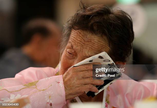 North Korean Ahn Kil-Ja, 85 weeps during a separated family reunion meeting at the Mount Kumgang resort on August 25, 2018 in Mount Kumgang, North...