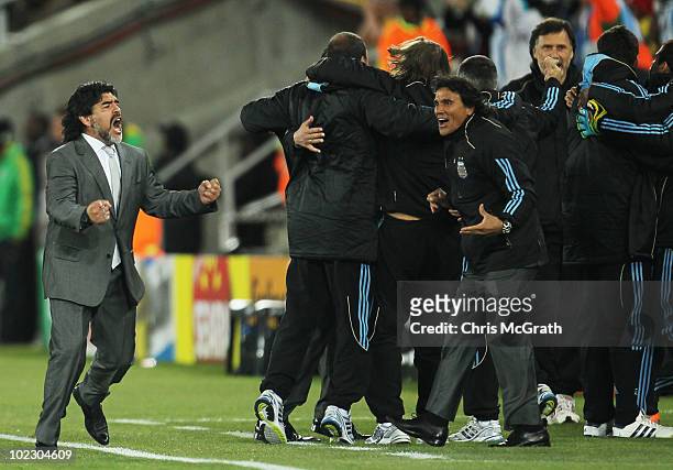 Diego Maradona head coach of Argentina celebrates Martin Demichelis scoring the opening goal during the 2010 FIFA World Cup South Africa Group B...