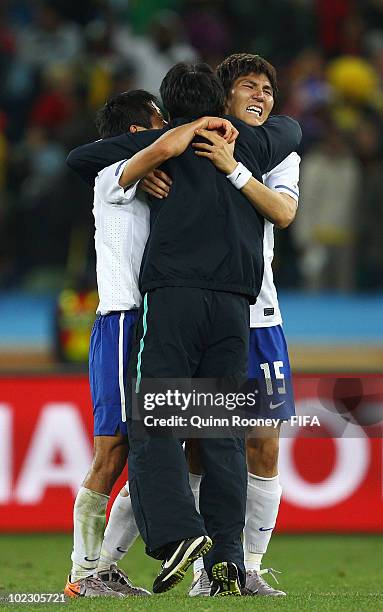 Kim Dong-Jin of South Korea celebrates with teammates after South Korea advance to the Round of 16 after a 2-2 draw in the 2010 FIFA World Cup South...