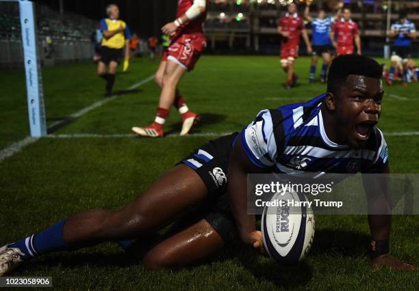 Levi Davies of Bath Rugby celebrates after scoring a try during the Pre Season Friendly match between Bath and Scarlets at the Recreation Ground on...