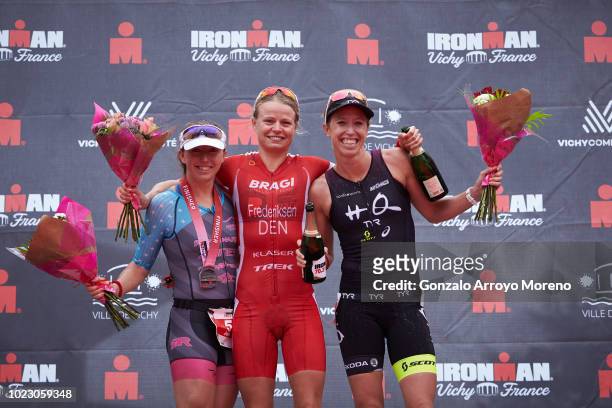 Winner pro female athlete Helle Frederiksen , second place Jocelyn McCauley and third place Lisa Norden pose for a picture at the top three podium...