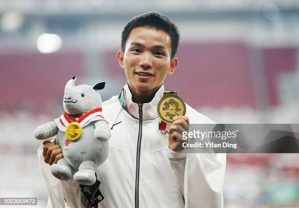 Gold Medallist Inoue Hiroto of Japan poses for photo during Men's Marathon medal ceremony on day seven of the Asian Games on August 25, 2018 in...