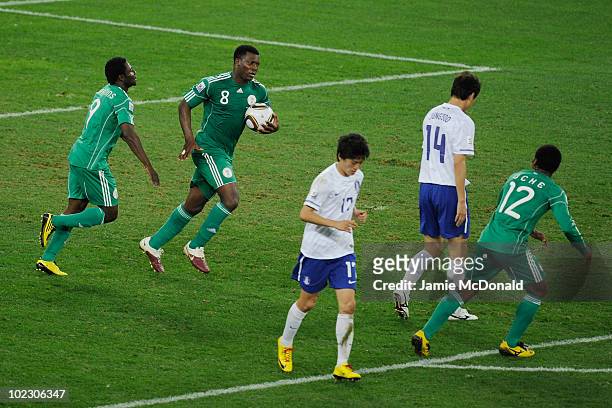 Yakubu Ayegbeni of Nigeria runs back to restart the match after scoring a penalty during the 2010 FIFA World Cup South Africa Group B match between...