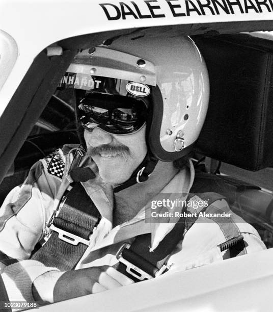 Driver Dale Earnhardt Sr. Sits in his racecar prior to the start of the 1980 Daytona 500 stock car race at Daytona International Speedway in Daytona...