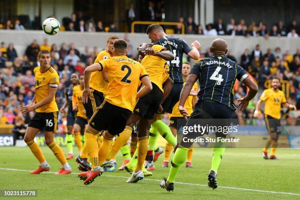 Aymeric Laporte of Manchester City scores his sides first goal during the Premier League match between Wolverhampton Wanderers and Manchester City at...